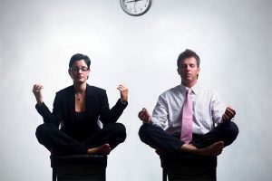 2 business people meditating