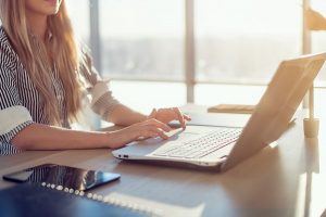 woman at computer keyboard